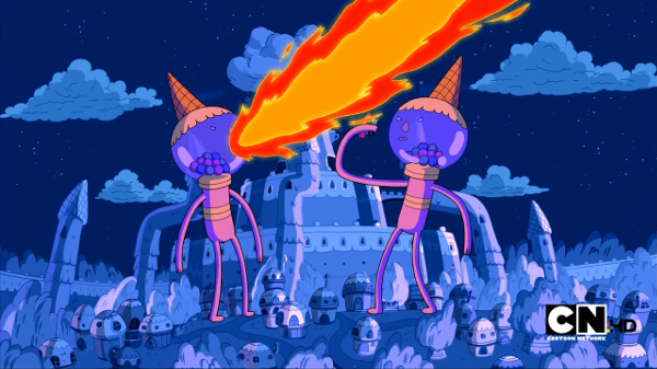 Two vast gumball machine people blow fire over a very blue version of the Candy Kingdom, consisting of various buildings made of candy. In one of their hands, Princess Bubblegum and Finn can be seen.