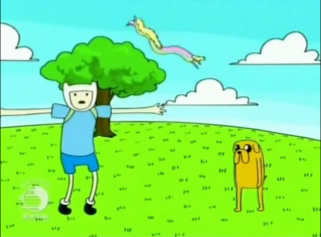 Pen the Human and Jake the Dog on a garishly coloured green field, with very flat, oddly stretched postures. Pen wears a pale blue tunic and a white hat covering his hair. Jake is a yellow cartoon dog with long jowls.