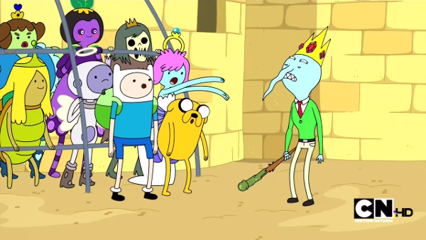 A large group of princesses in various shapes standing in a cage. Finn and Jake are standing in front of it, looking surprised, while the 'nice king' - a skinny, blue-skinned, weirdly lumpy figure in a green cardigan over a shirt and tie - looks down his wavy nose at them.