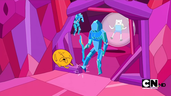 In an angular pink crystal chamber, a blue crystal soldier kicks a compressed Jake across the room. In the background, Finn is suspended in a translucent bubble.