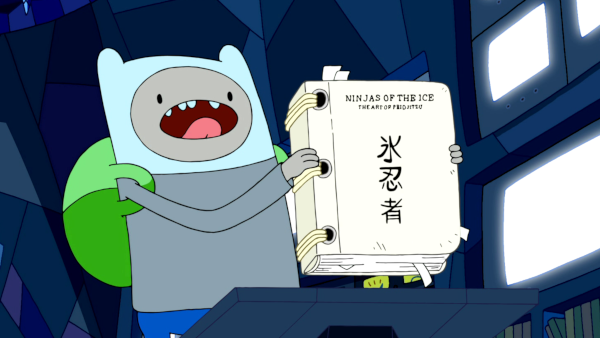 Finn holding a blue book labeled 'Ninjas of the Ice: The Art of Friojitzu' followed by the kanji 氷忍者