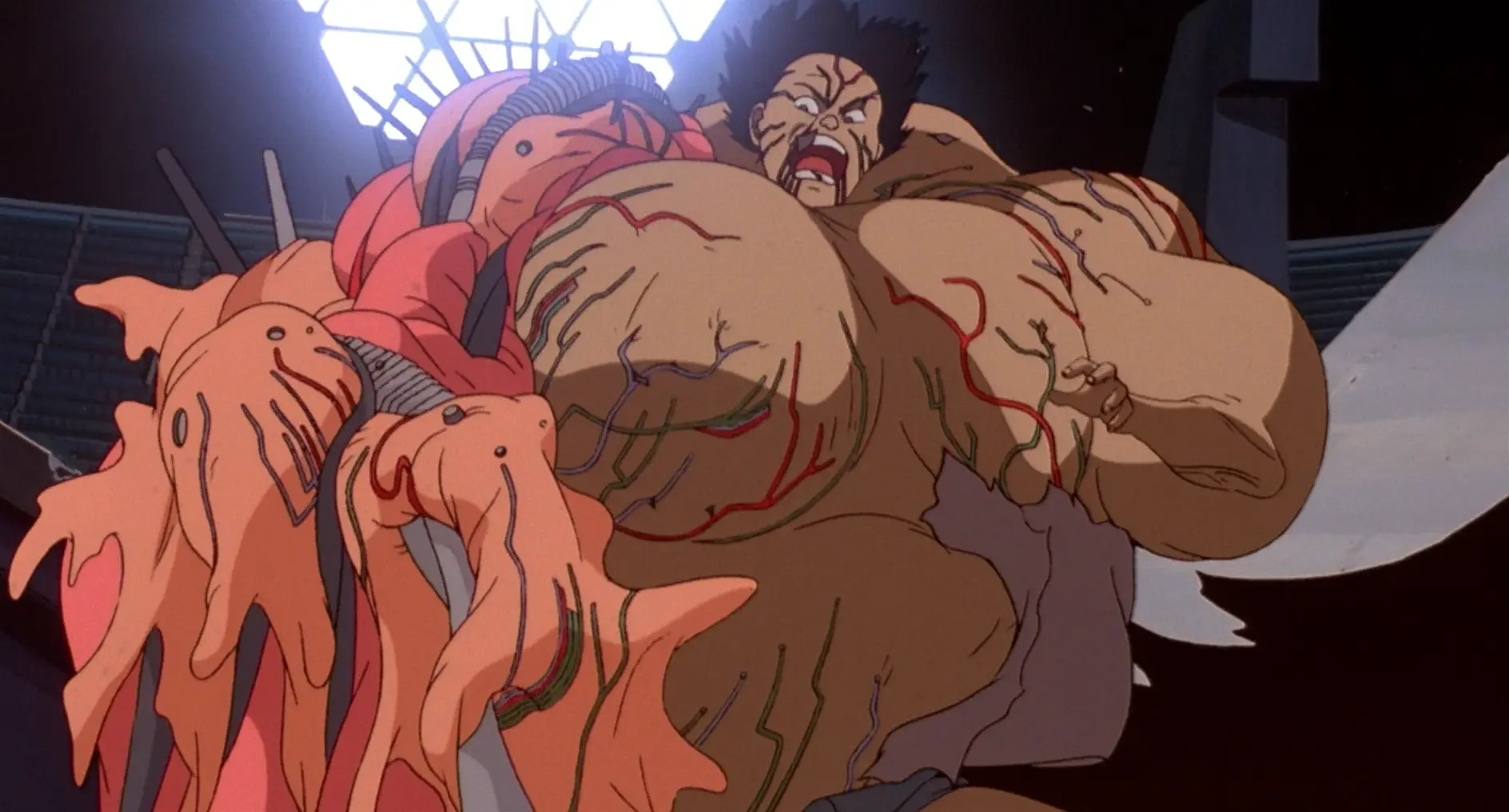 Still from Akira. Tetsuo has started to transform. His muscles bulge grotesquely, with the exception of one forearm which now appears comically small..