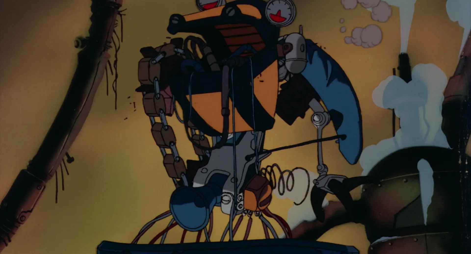Still from Chicken Man and Red Neck. A robot made of a cacophony of parts including a large excavator bucket, a megaphone, a chain link belt, and various small dials.