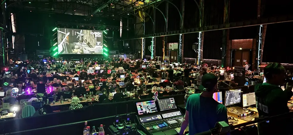 The view of the hall from the Beam Team platform, showing hundreds of people using all manner of computers in the huge E-Werk space.