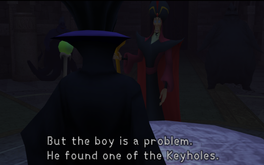 A murky image of two Disney villains. Malificent is facing Jafar across the table, saying 'But the boy is a problem. He found one of the Keyholes.'