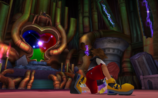 Sora kneeling with Kairi in front of the portal.